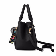 Load image into Gallery viewer, Women’s embroidered leather messenger bag with hairball accent - MELLIROSE